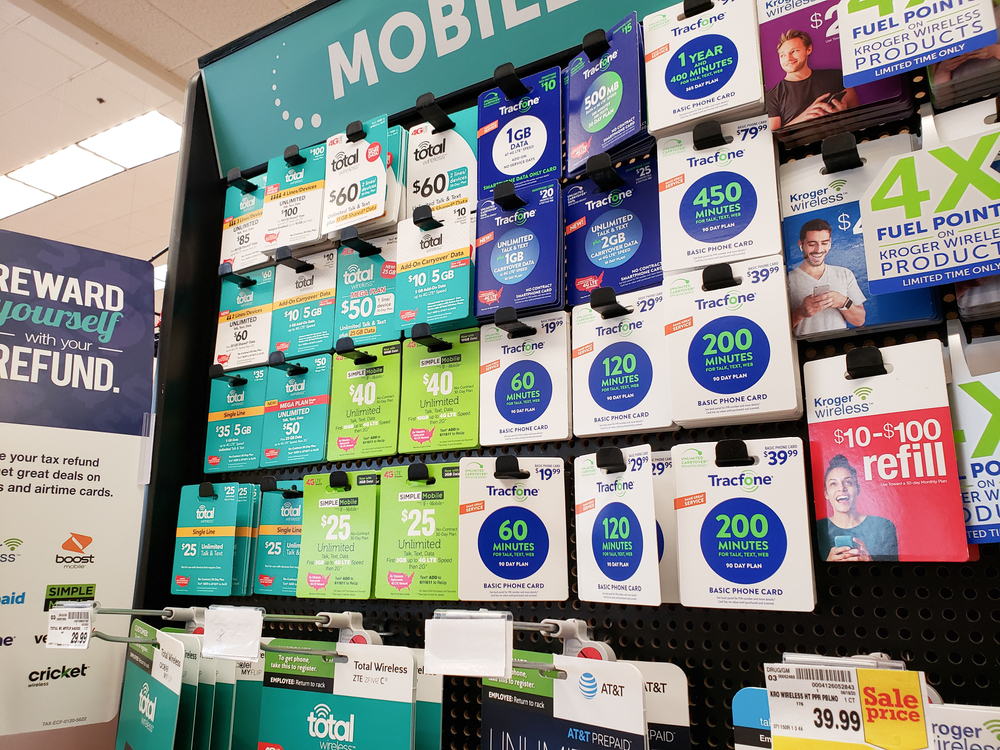 Los Angeles, California, United States - 07-01-2020: A view of several prepaid phone cards on display at a local grocery store, featuring brands as Tracfone, Simple Mobile and Total Wireless.