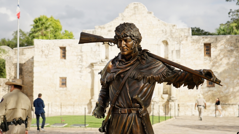 Famous bronze statue in front of the Alamo in San Antonio - SAN ANTONIO, TEXAS - NOVEMBER 01, 2022