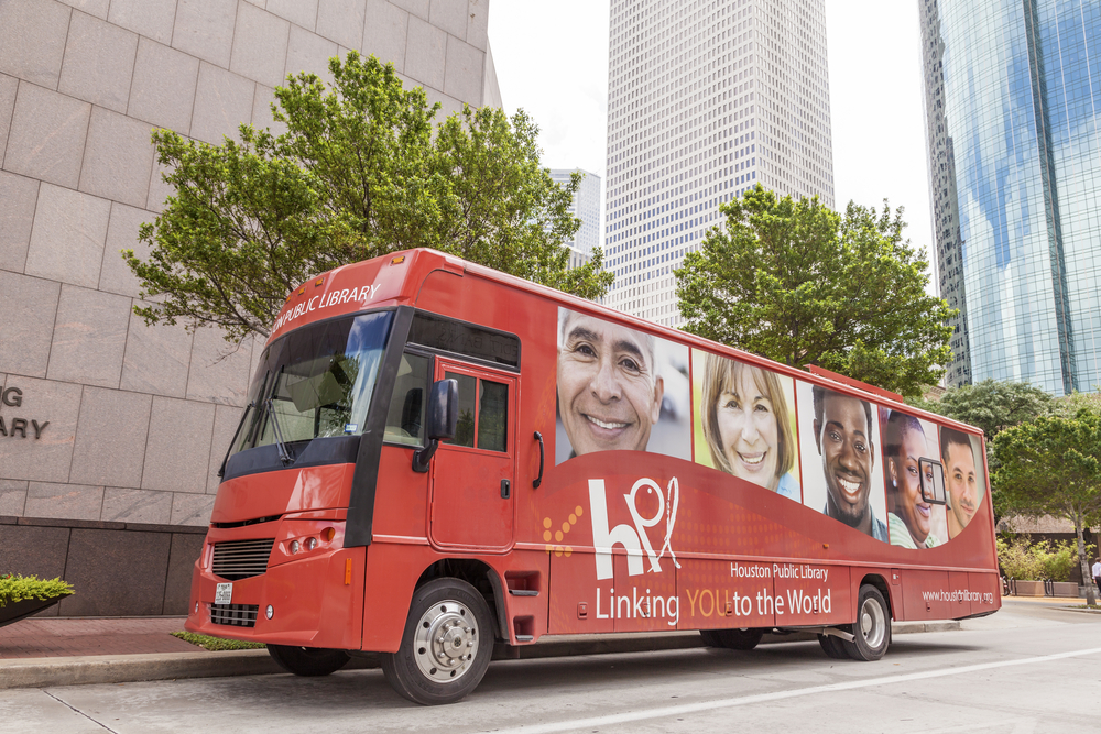 HOUSTON, USA - APR 14, 2016: Red public library bus downtown in Houston.  Texas, United States