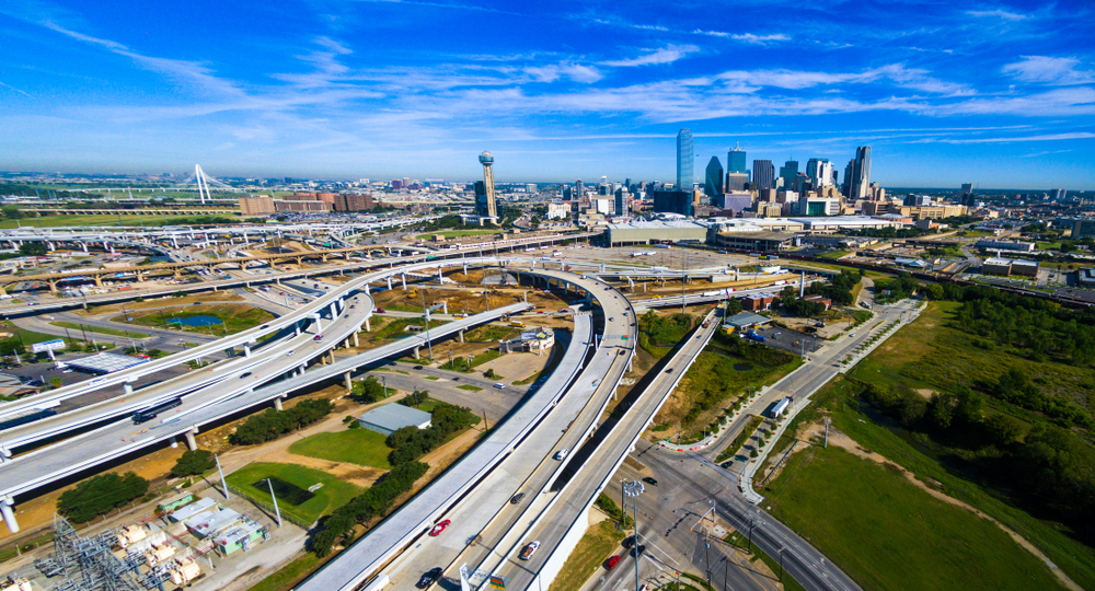 Aerial drone view of Dallas , Texas skyline cityscape massive construction of highways and overpasses transportation infruristructure