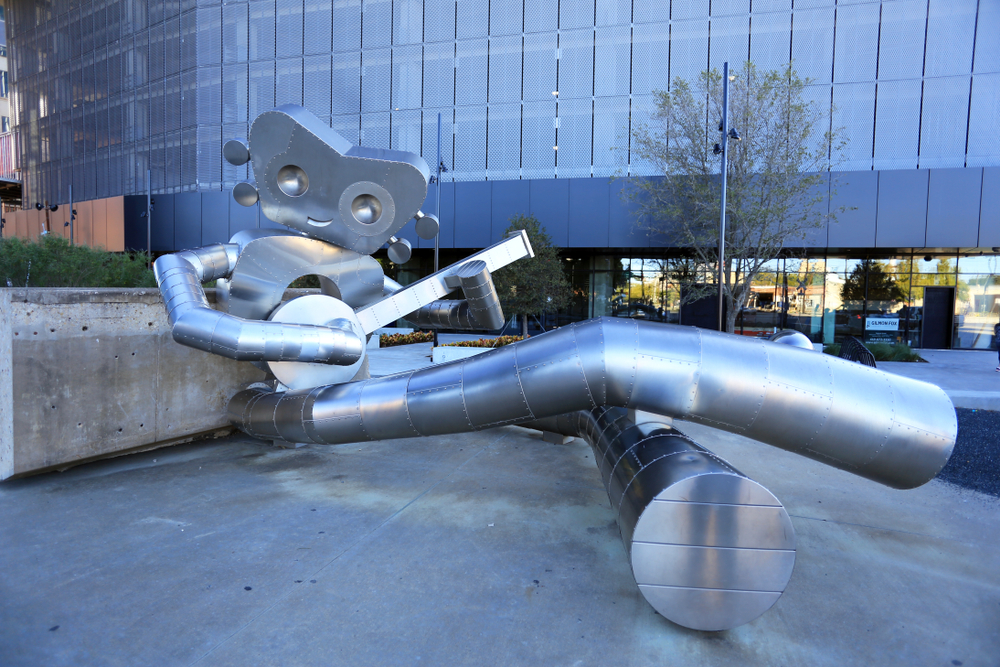 DEEP ELLUM STATION, DALLAS OCT 27: The DART Train Station is home to a three-part stainless steel sculpture series called The Traveling Man by local artist Brandon Oldenburg. Dallas TX, 10-27- 2019